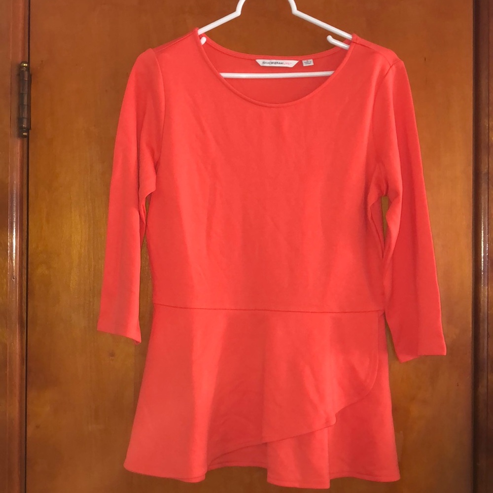 Vibrant coral 3/4 sleeve peplum knit top